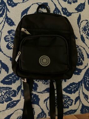 Sleek Black Mini Backpack with Front Pocket